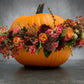 Fiori autunnali nella zucca