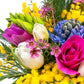 Bouquet di mimosa, tulipani, fresia, giacinti, anemoni