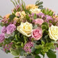 Bouquet di Rose, roselline in tonalità pastello e verde decorativo